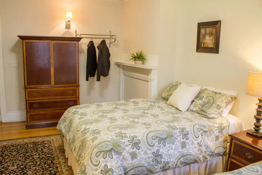 This quiet third-floor room offers two queen size beds and a writing desk and chair